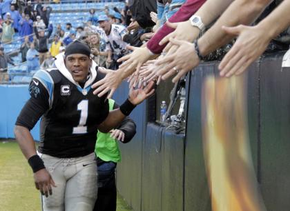 Cam Newton, man of the people. (AP Photo/Bob Leverone)