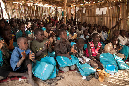 Children attend a class at a primary school in Muna Garage IDP camp, Maiduguri, Nigeria November 7, 2016. UNICEF/Naftalin/Handout via REUTERS