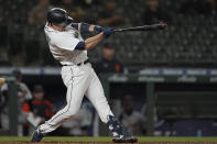 Seattle Mariners' Tom Murphy hits a solo home run during the eighth inning of a baseball game against the Detroit Tigers, Monday, May 17, 2021, in Seattle. (AP Photo/Ted S. Warren)