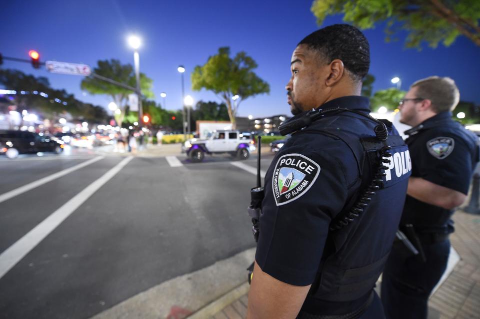 UAPD officers Kirk Simpkins and Will Clark stand on the corner of University Blvd. and Campus Drive in the heart of The Strip. The University of Alabama Police Department is putting more officers on The Strip this fall to help with law enforcement in the popular restaurant, bar, and entertainment area. Friday, Aug. 18, 2023.