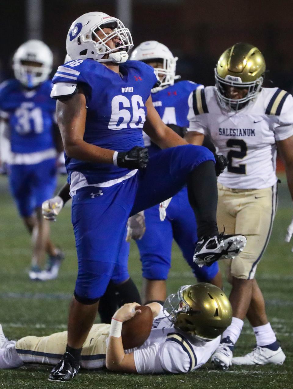 Dover's Mike Stevenson (66), shown here celebrating a Sept. 29 sack against Salesianum, has been named the Class 3A Lineman of the Year.