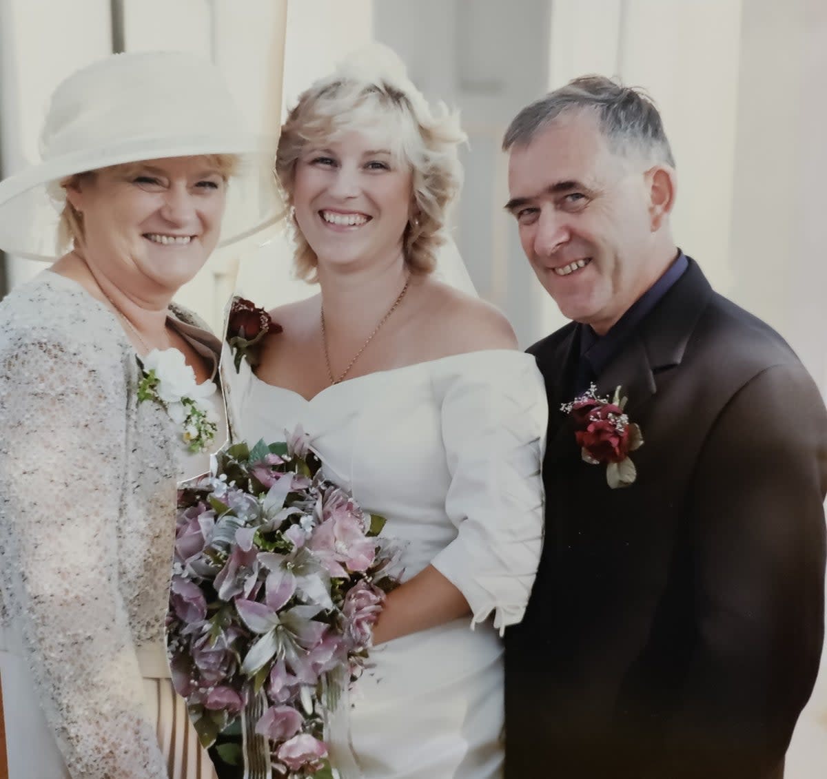 Keith Smith with his wife Carolann Smith, and his daughter Karen on her wedding day in 2000 (Supplied)