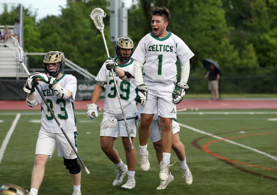 Dublin Jerome's Brady White (1) celebrates as he greets the rest of the Celtics with teammates Ethan Siddell (33) and Colin Colby (39) close behind following a 19-11 win over visiting Olentangy Liberty in the Division I, Region 1 final May 27.