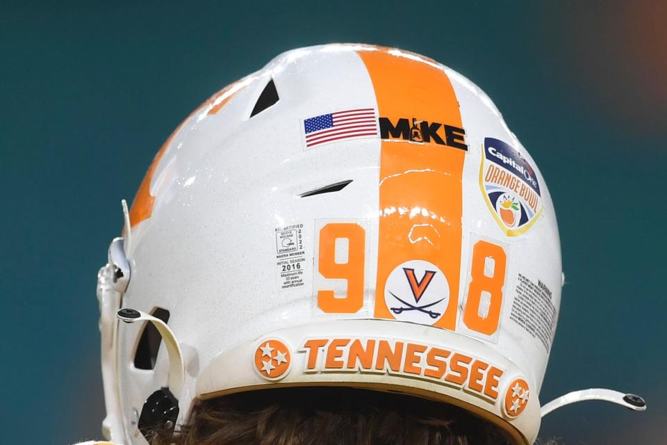 Stickers are seen on Tennessee punter Jackson Ross’ (98) helmet before the Orange Bowl game between the Tennessee Vols and Clemson Tigers at Hard Rock Stadium in Miami Gardens, Fla. on Friday, Dec. 30, 2022.