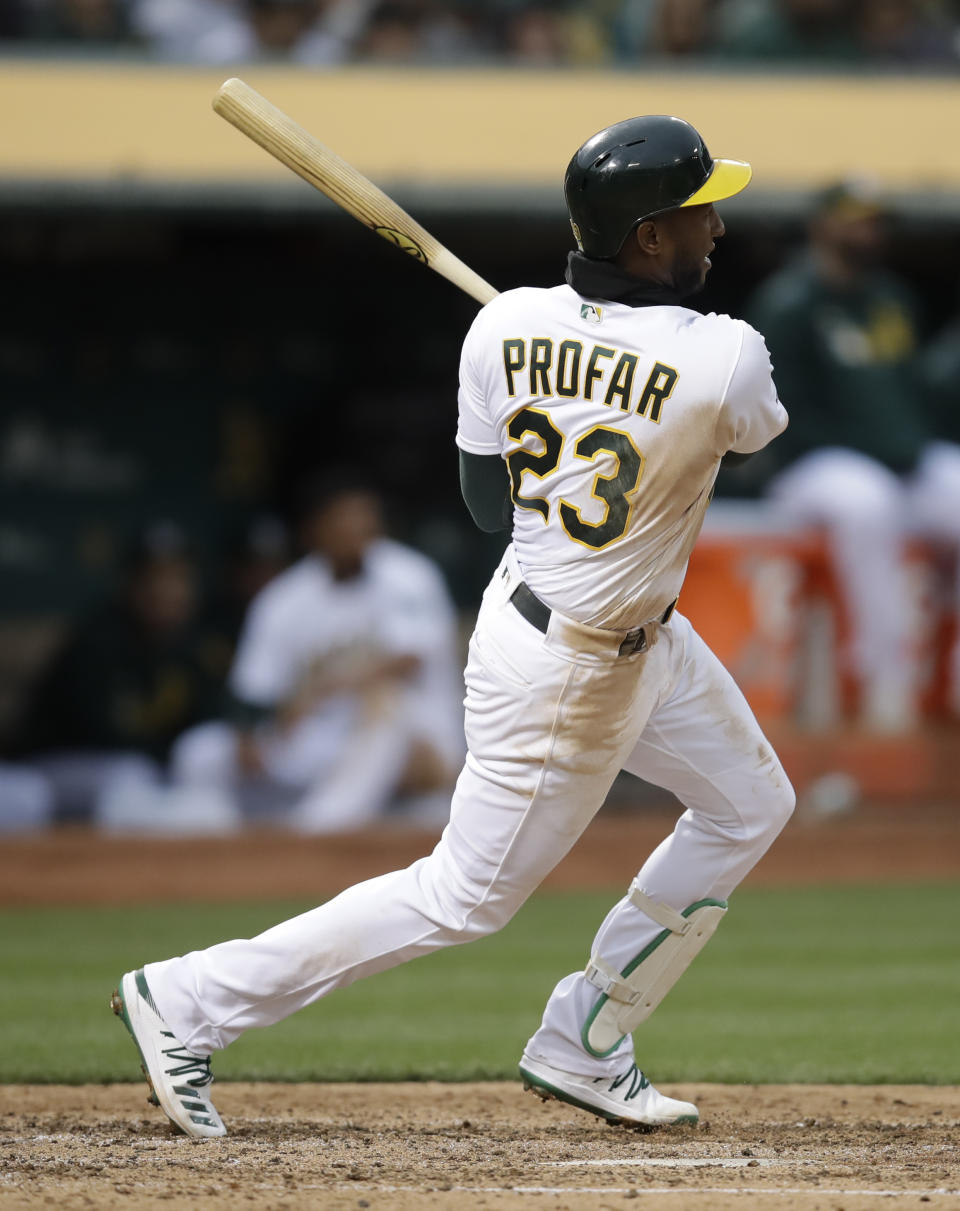 Oakland Athletics' Jurickson Profar swings for a two-run single off Seattle Mariners' Wade LeBlanc in the fourth inning of a baseball game Saturday, June 15, 2019, in Oakland, Calif. (AP Photo/Ben Margot)