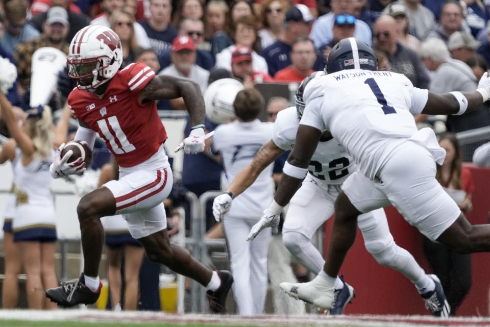 Wisconsin's Skyler Bell (11) runs after a catch during the first half of an NCAA college football game against Georgia Southern Saturday, Sept. 16, 2023, in Madison, Wis. (AP Photo/Morry Gash)