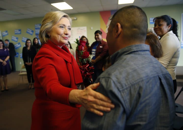 Democratic presidential candidate Hillary Clinton, left, meets with people at an event to speak with young immigrants, or so-called 