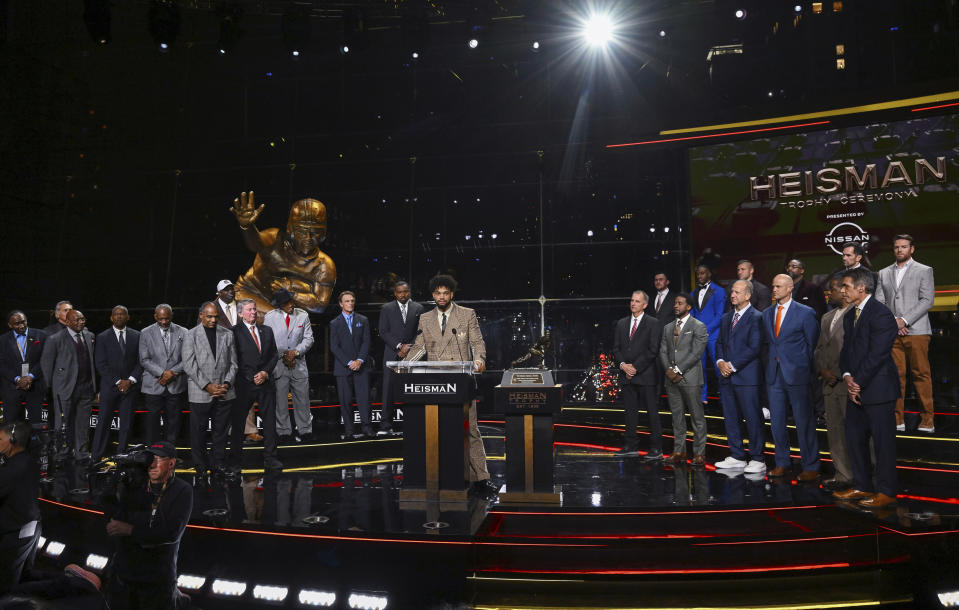 Southern California quarterback Caleb Williams, at podium, speaks after winning the Heisman Trophy on Saturday, Dec. 10, 2022, in New York. (Todd Van Emst/Pool Photo via AP)