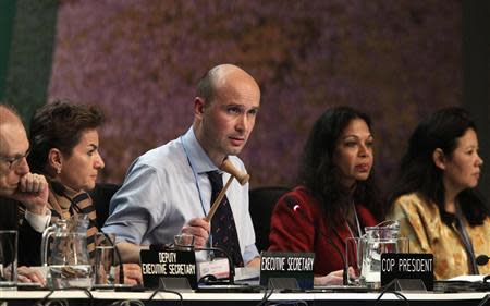 President of COP19 Marcin Korolec (C) gavels through final decisions at the closing session during the 19th conference of the United Nations Framework Convention on Climate Change (COP19) in Warsaw November 23, 2013. REUTERS/Kacper Pempel