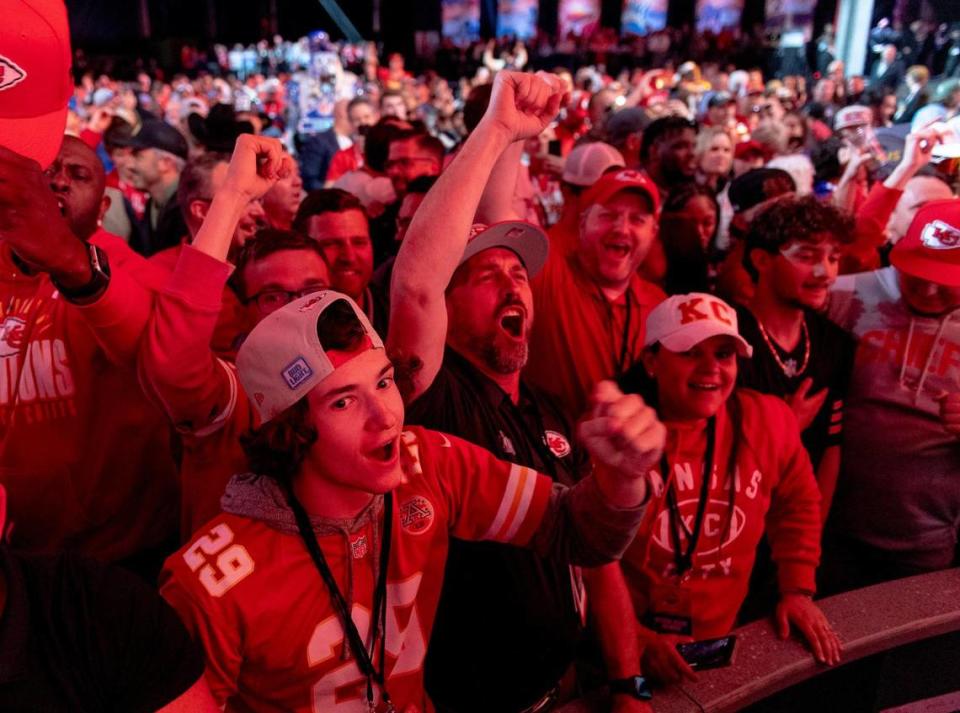 Kansas City Chiefs fans celebrate the team’s first round pick of Kansas State defensive lineman Felix Anudike-Uzomah during the NFL Draft outside of Union Station on Thursday, April 27, 2023, in Kansas City.