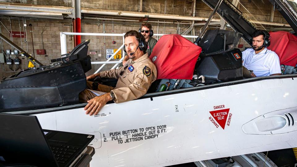 William Gray, chief test pilot at the Air Force Test Pilot School, and other engineers conduct software updates to the X-62 VISTA jet at Edwards Air Force Base, California, Aug. 3, 2022. (Giancarlo Casem/Air Force photo)