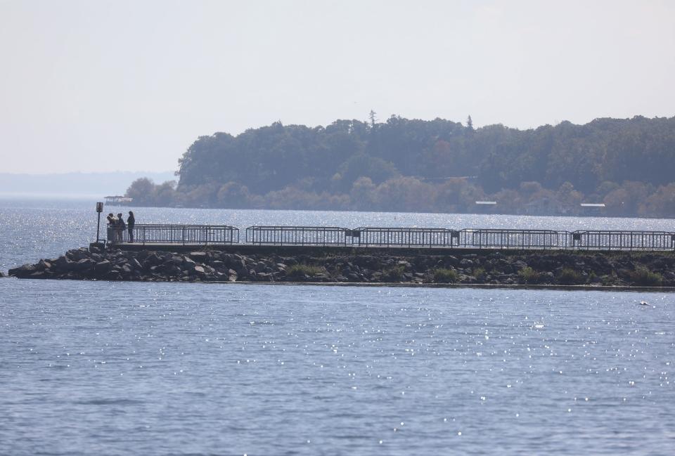 Seneca Lake in Geneva has a visitors center that introduces visitors to all that the Finger Lakes region offers. Visitors walk out on a break wall to take in the view.