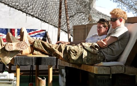 Prince Harry (right) relaxes with fellow Pilots - many ex-servicemen miss the camaraderie the army gave them - Credit: John Stillwell/Getty Images