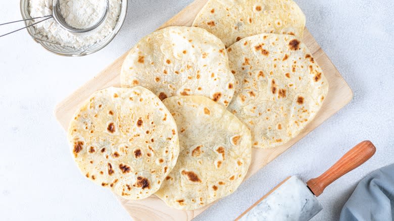 homemade flour tortillas on wood board