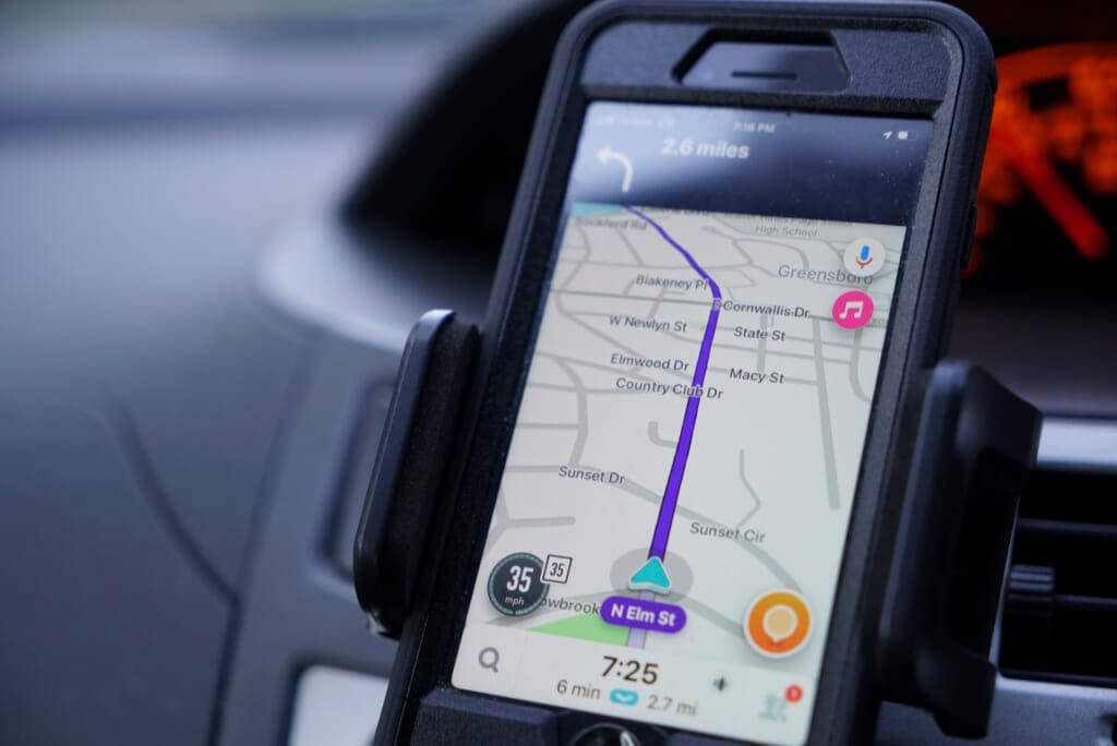 Former police data analyst Davin Hall uses the Waze navigation app while driving through Greensboro, N.C., on Wednesday, June 22, 2022. (AP Photo/Allen G. Breed)