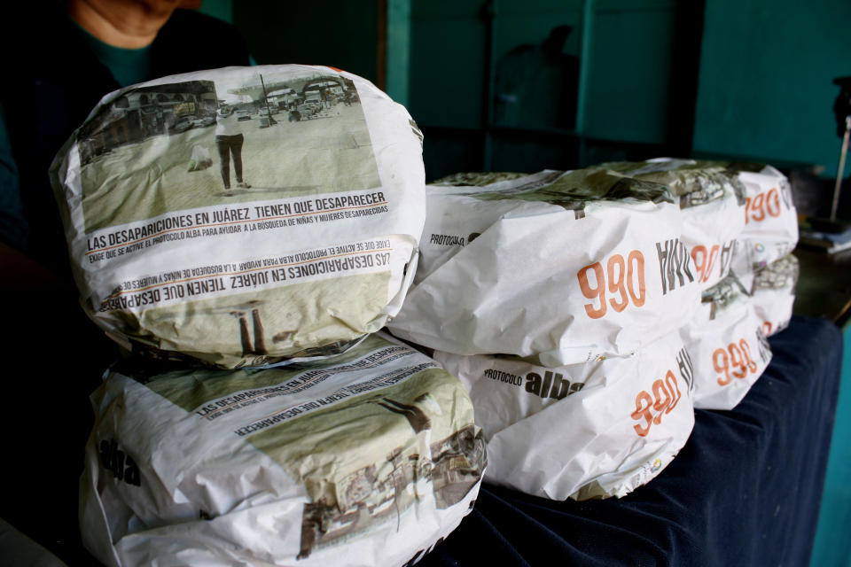 One kilogram packages of corn tortillas, packaged with advertisements asking for help to find missing women and children, sit for sale at the Hermanos Escobar Tortilla shop in the northern border city of Ciudad Juarez, Mexico, Tuesday Nov. 13, 2012. At least three dozen tortilla shops have joined in the Chihuahua state campaign to print appeals for help on the thin paper wrappers that shopkeepers use to wrap up a pound or two of hot tortillas at a time. (AP Photo/Raymundo Ruiz)