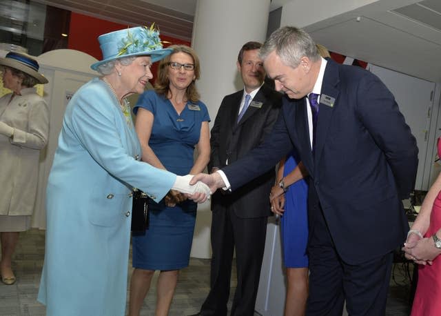 The late Queen Elizabeth II meets Huw Edwards