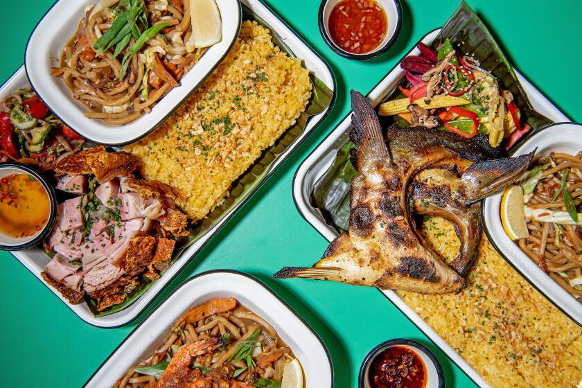 LOS ANGELES, CA - OCTOBER 18: clockwise from top left: Lucena chon, hiramasa collar, and pancit with blue prawns from Kuya Lord on Tuesday, Oct. 18, 2022 in Los Angeles, CA.(Mariah Tauger / Los Angeles Times)