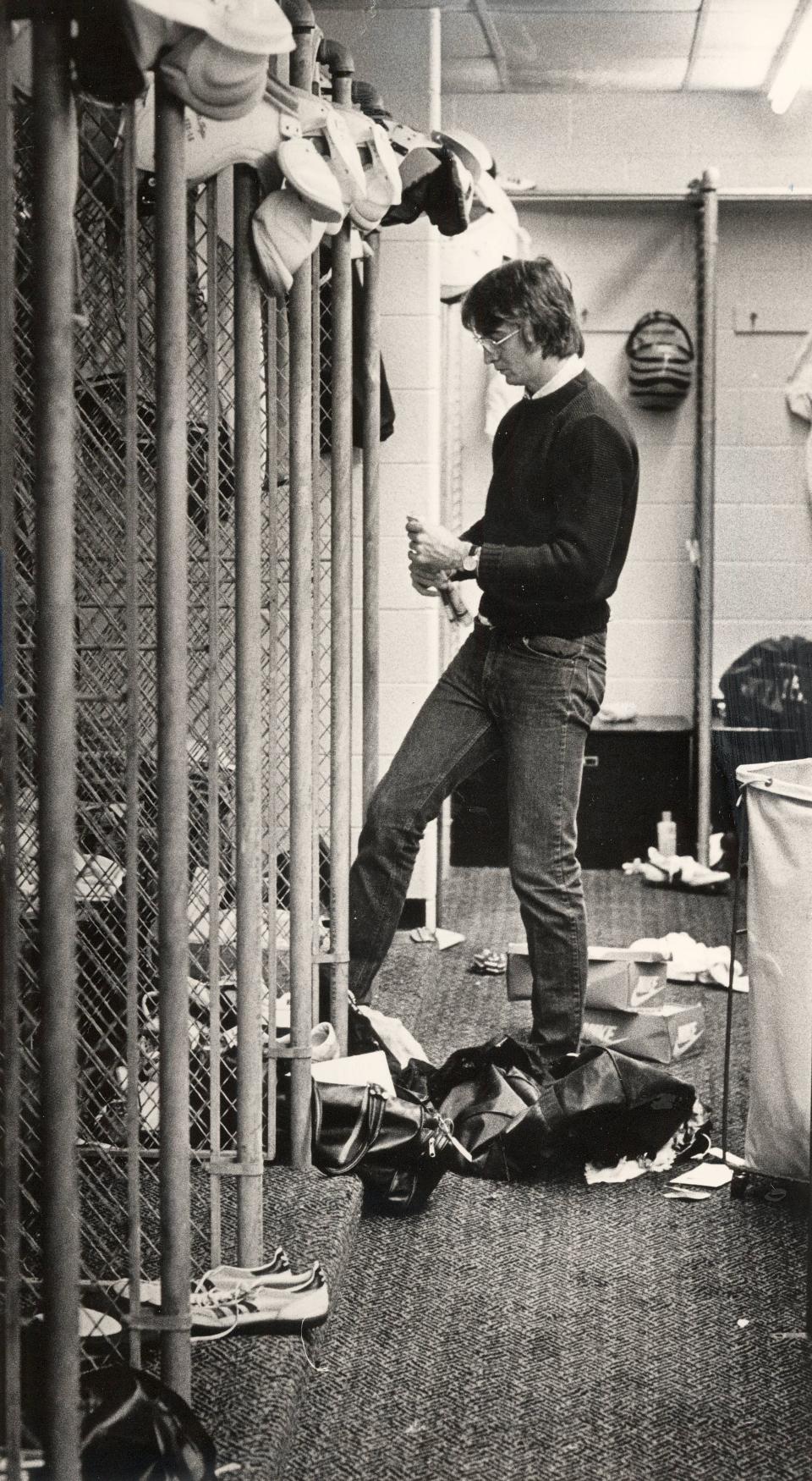 DECEMBER 18, 1984: Bengals wide receiver Cris Collinsworth cleans out his locker at Spinney Field for what may be the last time Monday. The wide receiver is scheduled to play in the USFL next season.