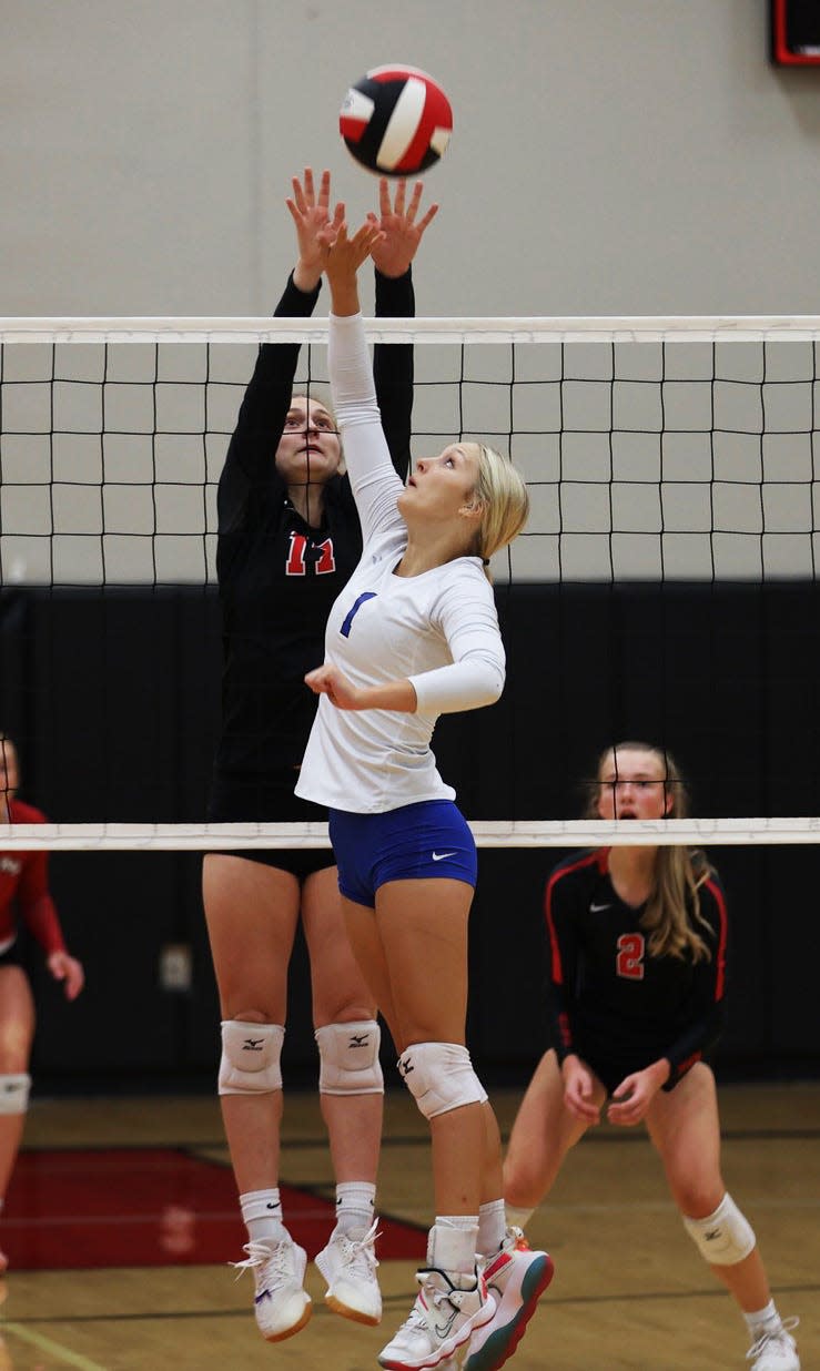 Roland-Story's Kenzie Flick goes up for a block for the Norse volleyball team during a sweep of Perry Sept. 20 at Story City.