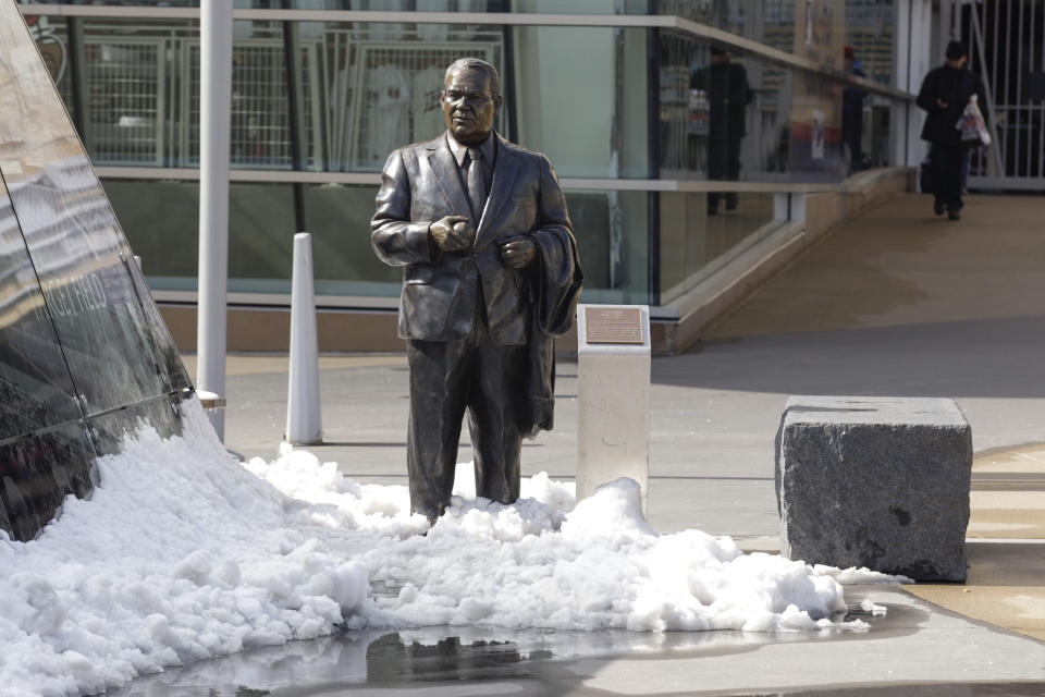 FILE - In this April 17, 2014, file photo, a statue of former Twins' owner Calvin Griffith stands in the snow outside Target Field before a baseball game between the Minnesota Twins and the Toronto Blue Jays in Minneapolis. The Twins say they’ve removed a statue of former owner Calvin Griffith at Target Field, citing racist remarks he made in 1978. (AP Photo/Paul Battaglia, File)