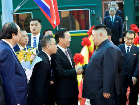 North Korea's leader Kim Jong Un (R) greeted by Vietnam's Communist Party's Politburo member Vo Van Thuong upon his arrval at the border town with China in Dong Dang, Vietnam, February 26, 2019. Nhan Sang/VNA via REUTERS