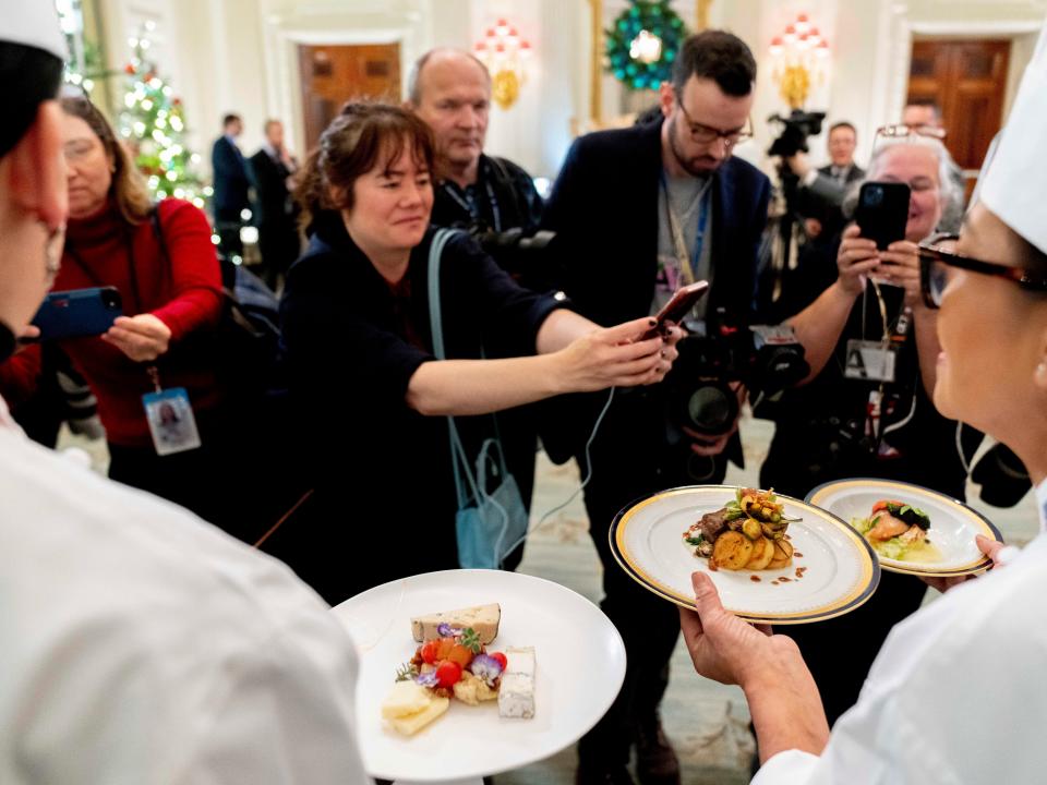 White House executive chef Cris Comerford (R) and White House executive pastry chef Susie Morrison (L) present dishes during a media preview for the State Dinner with President Joe Biden and French President Emmanuel Macron.