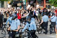 People gather at the Minneapolis Police Department's Third Precinct station to protest the death of George Floyd, in Minneapolis, Minnesota