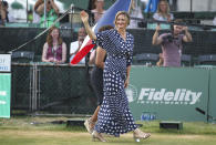 Tennis Hall of Fame inductee Mary Pierce of France waves to the crowd as she is introduced during ceremonies at the International Tennis Hall of Fame, Saturday, July 20, 2019, in Newport, R.I. (AP Photo/Stew Milne)