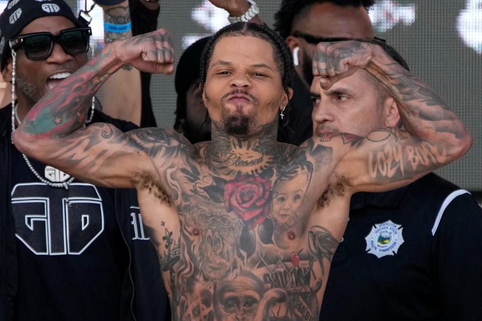 Gervonta Davis poses on the scale during a weigh-in Friday, April 21, 2023, in Las Vegas. Davis is scheduled to fight Ryan Garcia in a catchweight boxing bout in Las Vegas on Saturday. (AP Photo/John Locher)