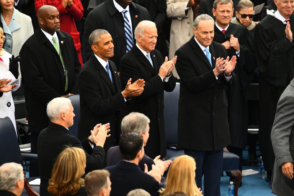 Former President Barack Obama, former Vice President Joe Biden and Sen. Chuck Schumer, D-NY, applaud after Donald Trump took the oath of office, during the 2017 Presidential Inauguration at the U.S. Capitol on Jan 20, 2017.