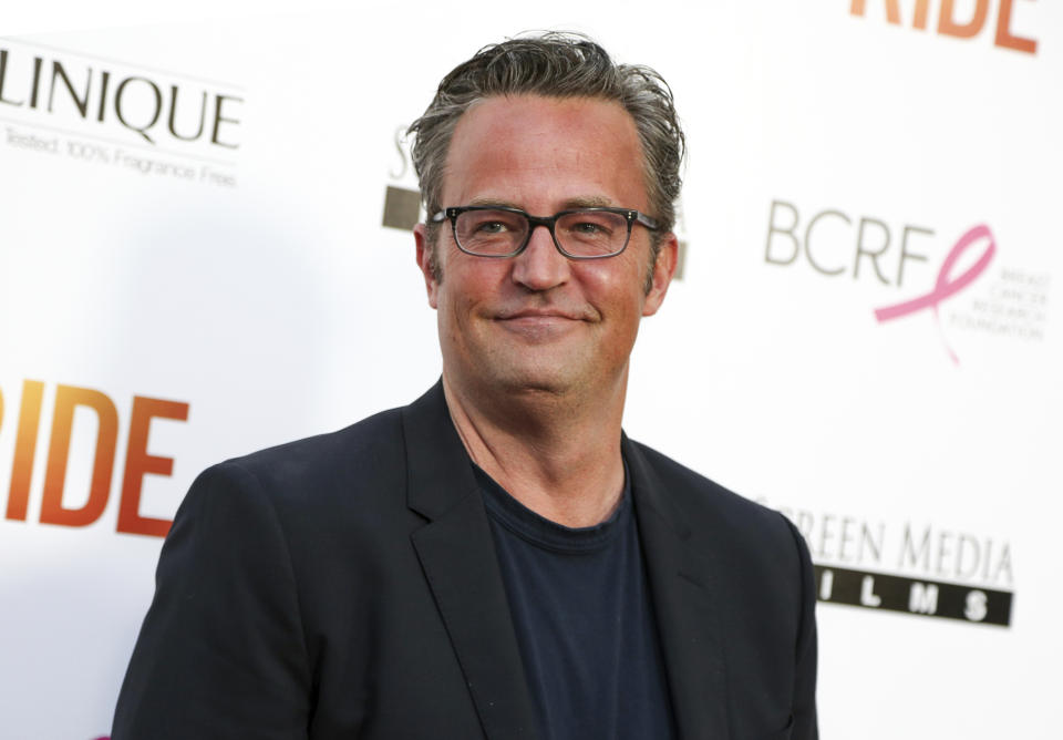 Matthew Perry smiles at a press event.