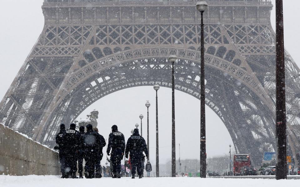 French police on patrol near the Eiffel Tower - REUTERS