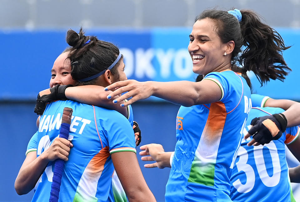 Players of India celebrate after defeating Australia 1-0 in their women's quarter-final match of the Tokyo 2020 Olympic Games field hockey competition, at the Oi Hockey Stadium in Tokyo, on August 2, 2021. (Photo by CHARLY TRIBALLEAU / AFP) (Photo by CHARLY TRIBALLEAU/AFP via Getty Images)