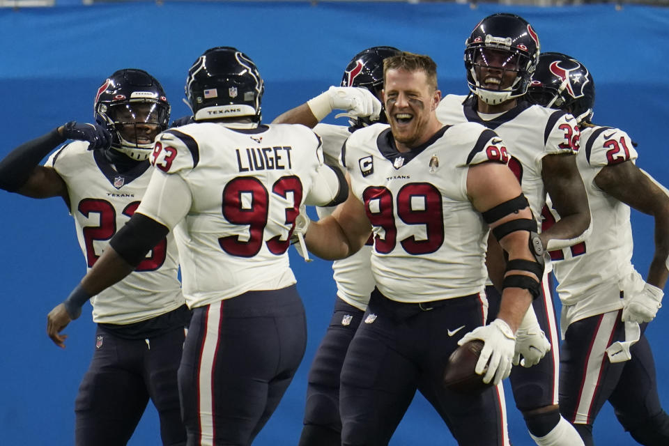 Houston Texans defensive end J.J. Watt (99) celebrates his interception for a touchdown during the first half of an NFL football game against the Detroit Lions, Thursday, Nov. 26, 2020, in Detroit. (AP Photo/Paul Sancya)