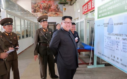 North Korean leader Kim Jong-Un smiles during a visit to the Chemical Material Institute of the Academy of Defense Science in this undated photo released by North Korea's Korean Central News Agency (KCNA) in Pyongyang on August23, 2017 - Credit: Reuters