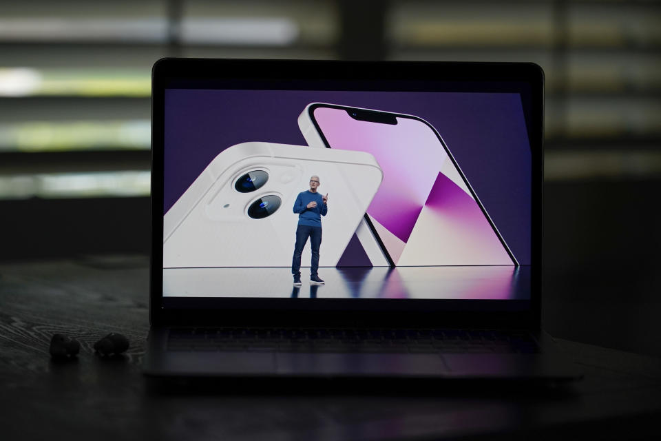 Seen on the screen of a device in La Habra, Calif., Apple CEO Tim Cook introduces the new iPhone 13 smartphones during a virtual event held to announce new Apple products Tuesday, Sept. 14, 2021. (AP Photo/Jae C. Hong)