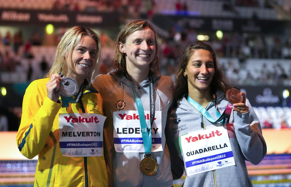 Silver medalist Kiah Melverton of Australia, left, gold medalist Katie Ledecky of the United States, centre, bronze medalist Simona Quadarella of Italy, right, pose with their medals after the Women 800m Freestyle final at the 19th FINA World Championships in Budapest, Hungary, Friday, June 24, 2022. (AP Photo/Petr David Josek)
