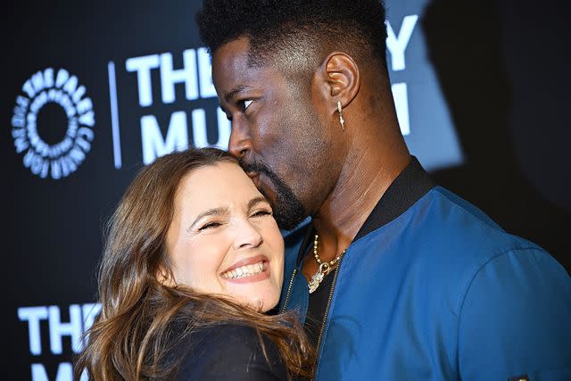 <p>Steven Ferdman/Getty</p> Drew Barrymore and Nate Burleson