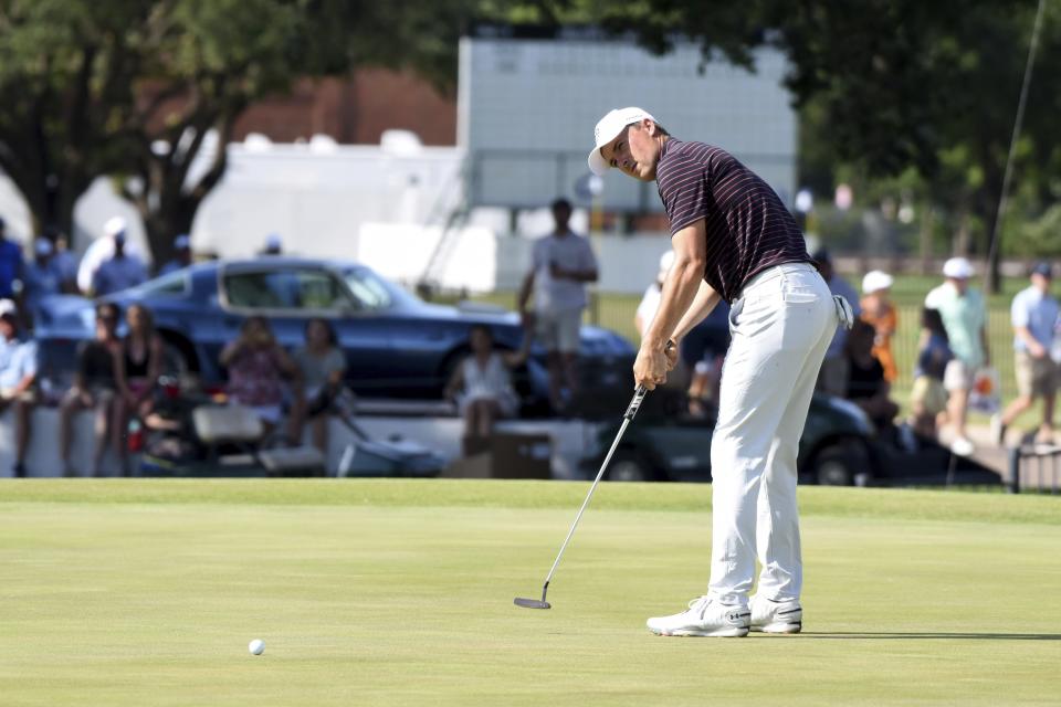 Jordan Spieth putts on the 18th green during the third round of the Charles Schwab Challenge golf tournament at Colonial Country Club, Saturday, May 28, 2022, in Fort Worth, Texas. (AP Photo/Emil Lippe)