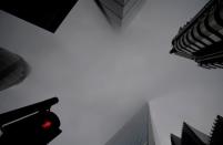 FILE PHOTO: Skyscrapers in the City of London financial district are seen on a foggy morning amid the spread of the coronavirus disease (COVID-19), London, Britain