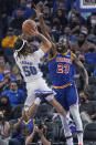 Orlando Magic guard Cole Anthony (50) shoots against Golden State Warriors forward Draymond Green (23) during the first half of an NBA basketball game in San Francisco, Monday, Dec. 6, 2021. (AP Photo/Jeff Chiu)