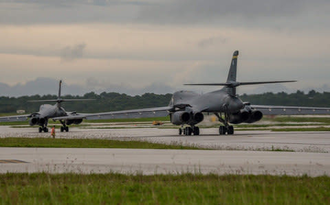 Two US Air Force B-1B Lancers prepare to take off from Andersen Air Force Base, Guam - Credit: AFP