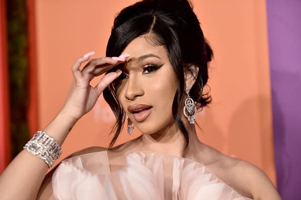 Cardi B Wears Floral Face Mask at Paris Fashion Week