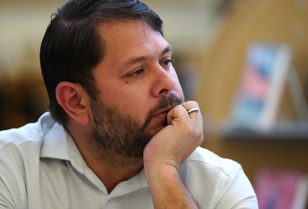 Rep. Ruben Gallego listens to community members and leaders during a listening session at Cesar Chavez High School Library on April 20, 2022, in Phoenix.