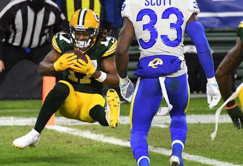 GREEN BAY, WISCONSIN JANUARY 16, 2021-Packers receiver Davante Adams catches a touchdown pass.
