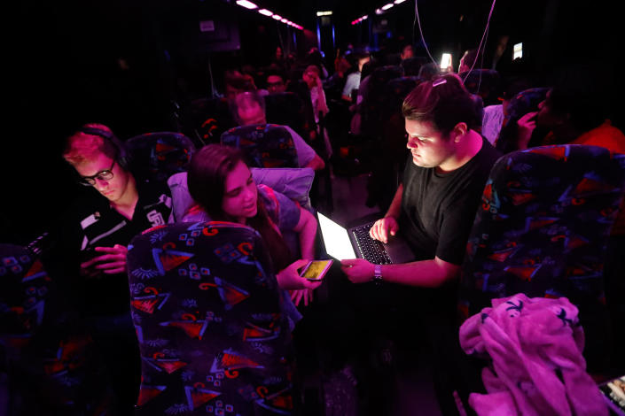 <p>Demitri Hoth, right, asks for feedback from Bailey Feuerman, on an open letter he is writing to legislators, as they and fellow student survivors from Marjory Stoneman Douglas High School, ride aboard their bus between Parkland, Fla., and Tallahassee, Fla., Tuesday, Feb. 20, 2018, to rally outside the state capitol and talk to legislators about gun control reform. (Photo: Gerald Herbert/AP) </p>