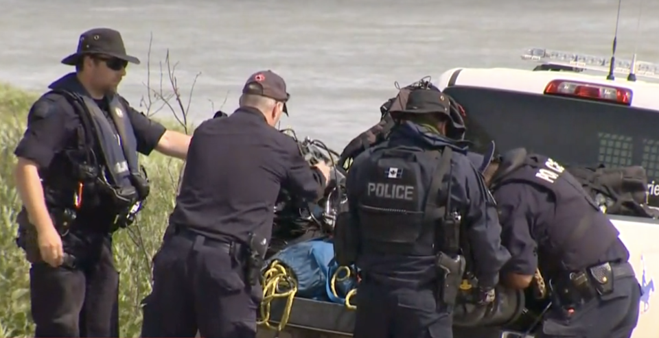 Pictured is RCMP officers preparing a search in and near the Nelson River, Manitoba.