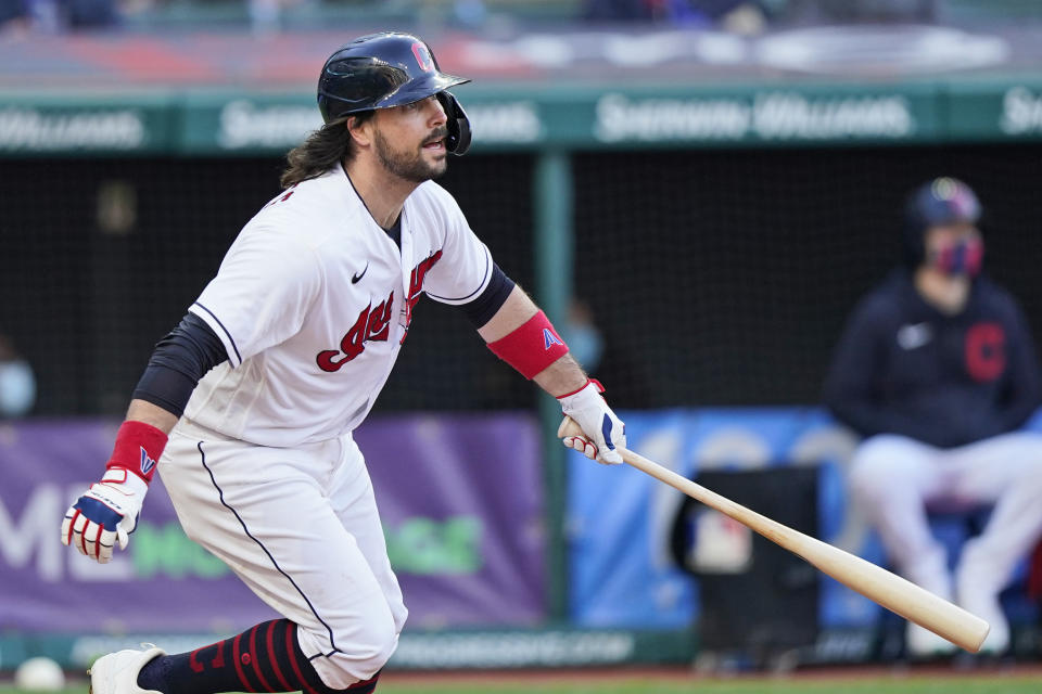 Cleveland Indians' Austin Hedges watches his RBI single during the fourth inning of the team's baseball game against the Cincinnati Reds, Saturday, May 8, 2021, in Cleveland. (AP Photo/Tony Dejak)