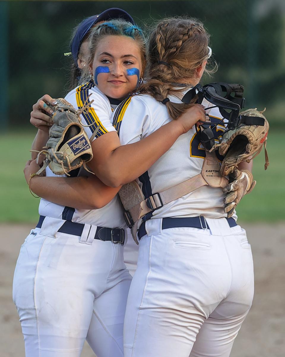 Hartland pitcher Kylie Swierkos (left) embraces catcher Sadie Malik following a 3-0 victory over Grosse Pointe North in the state quarterfinals Wednesday, June 14, 2023 at Wayne State University.